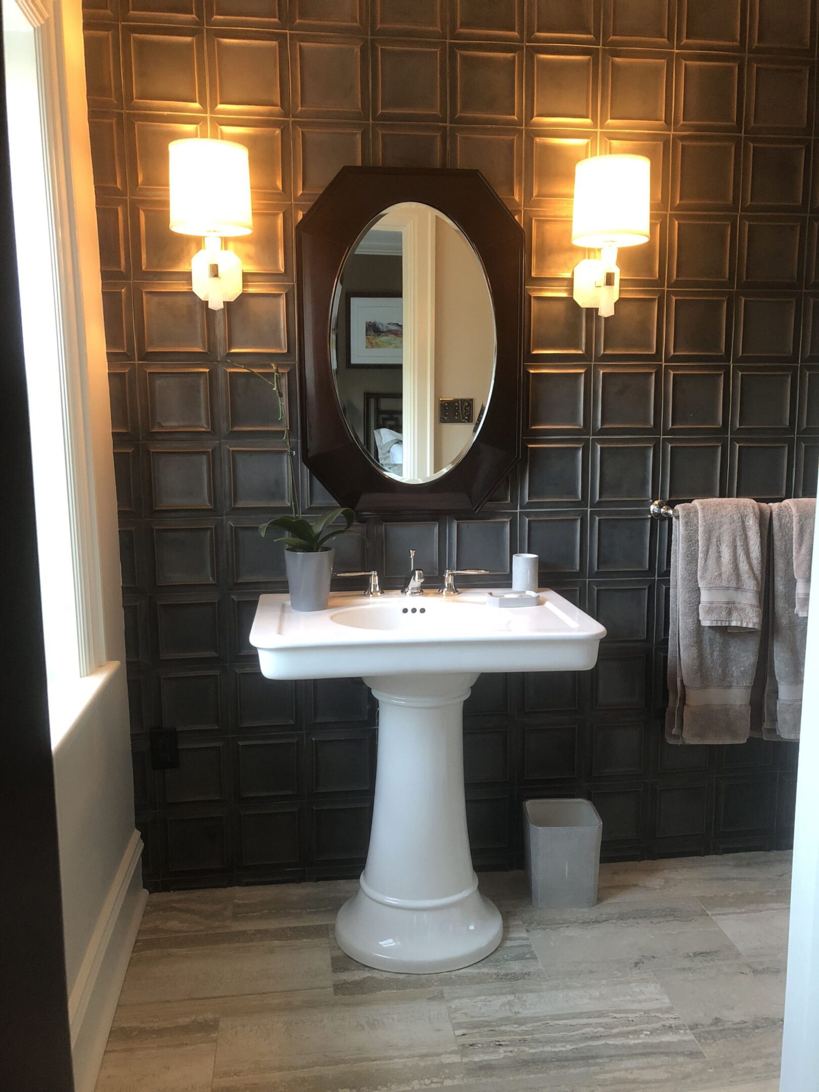 Modern bathroom with black tile wall