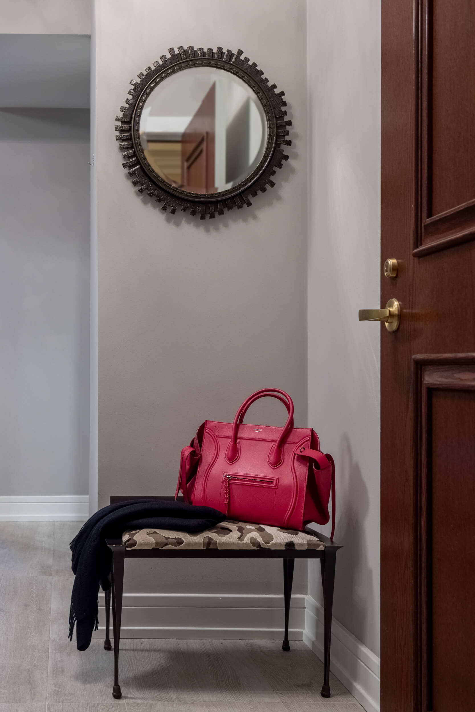 Pink handbag on hallway bench