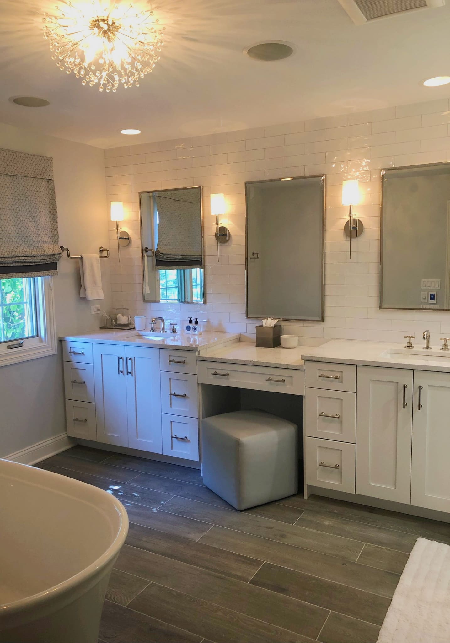 Spacious bathroom with bathtub and windows