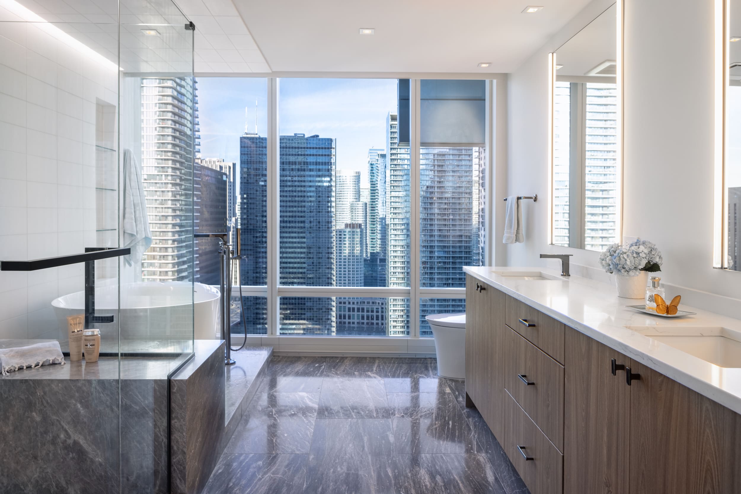 Contemporary bathroom featuring urban skyline