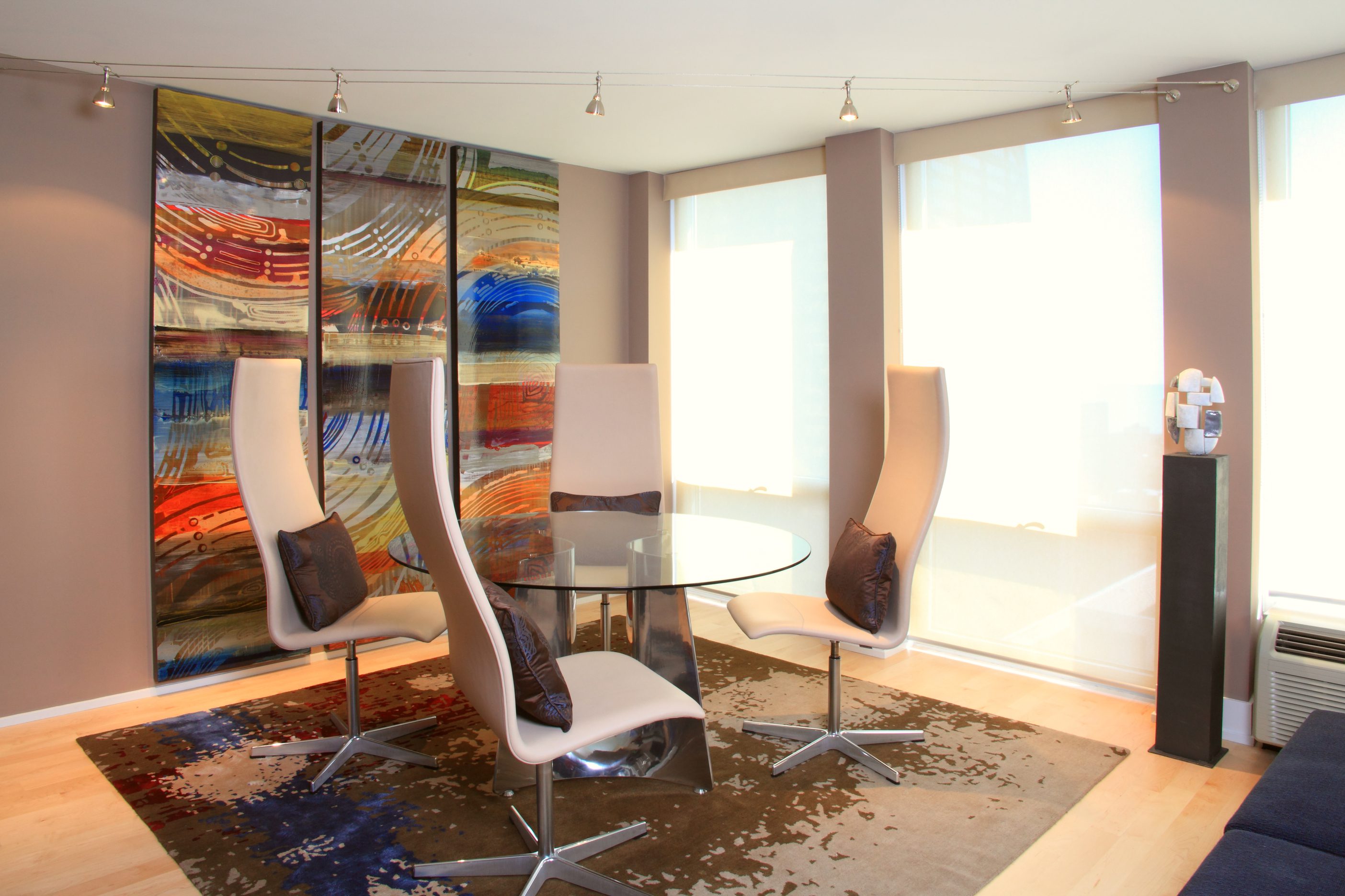 Contemporary chairs around glass table