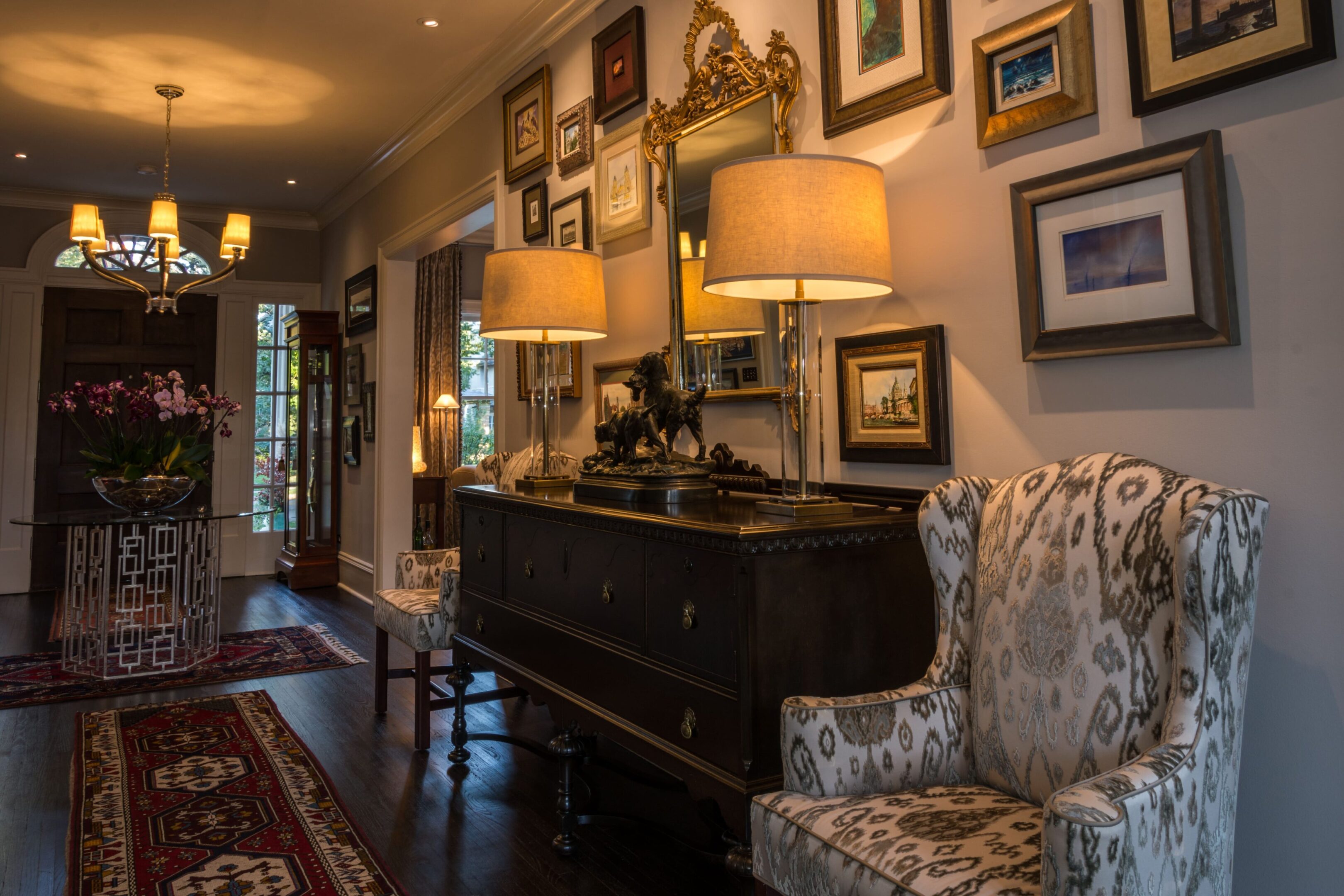 Cozy hallway with lamps and patterned chair