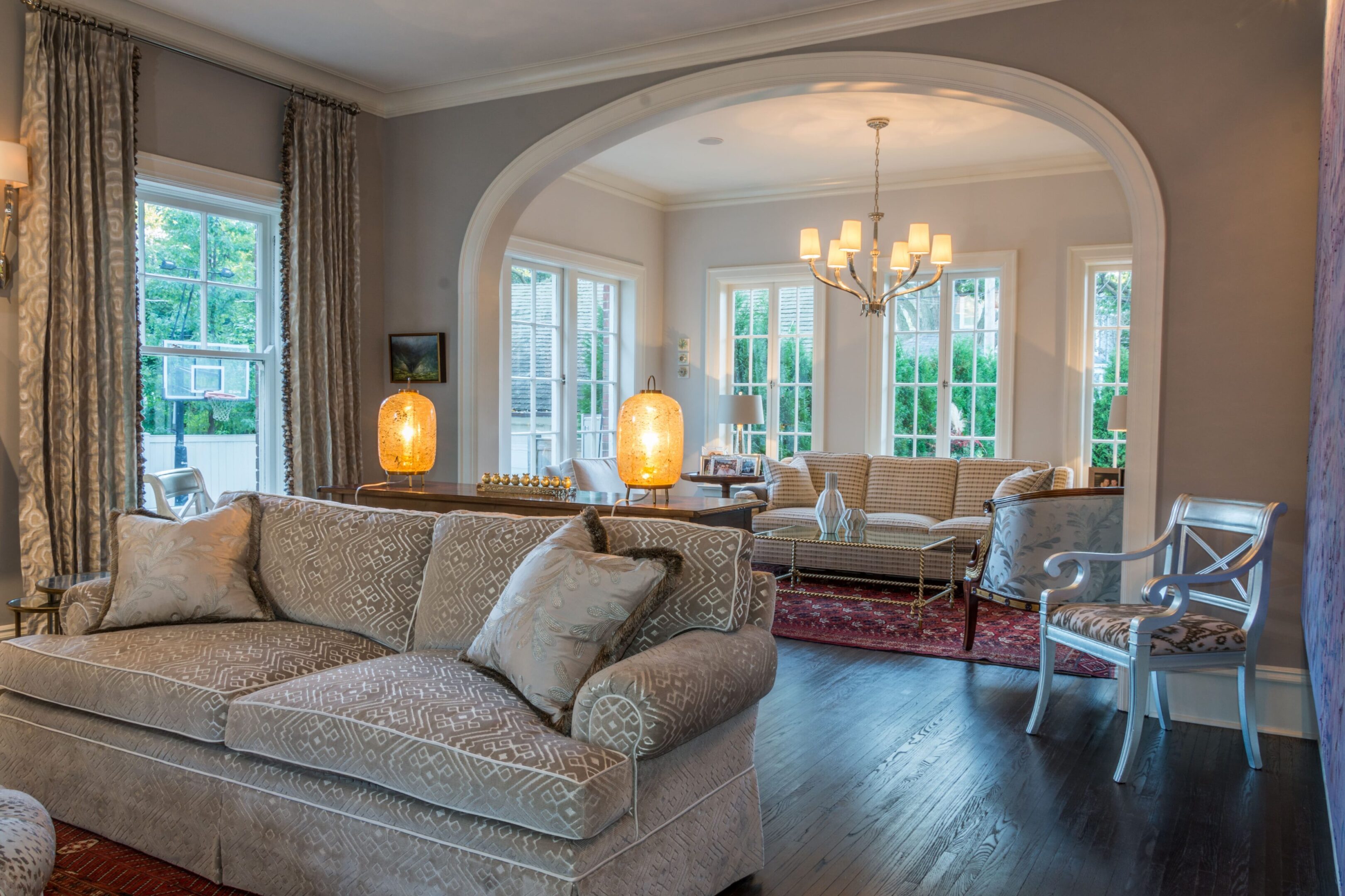 Spacious room with soft lighting and decor.
