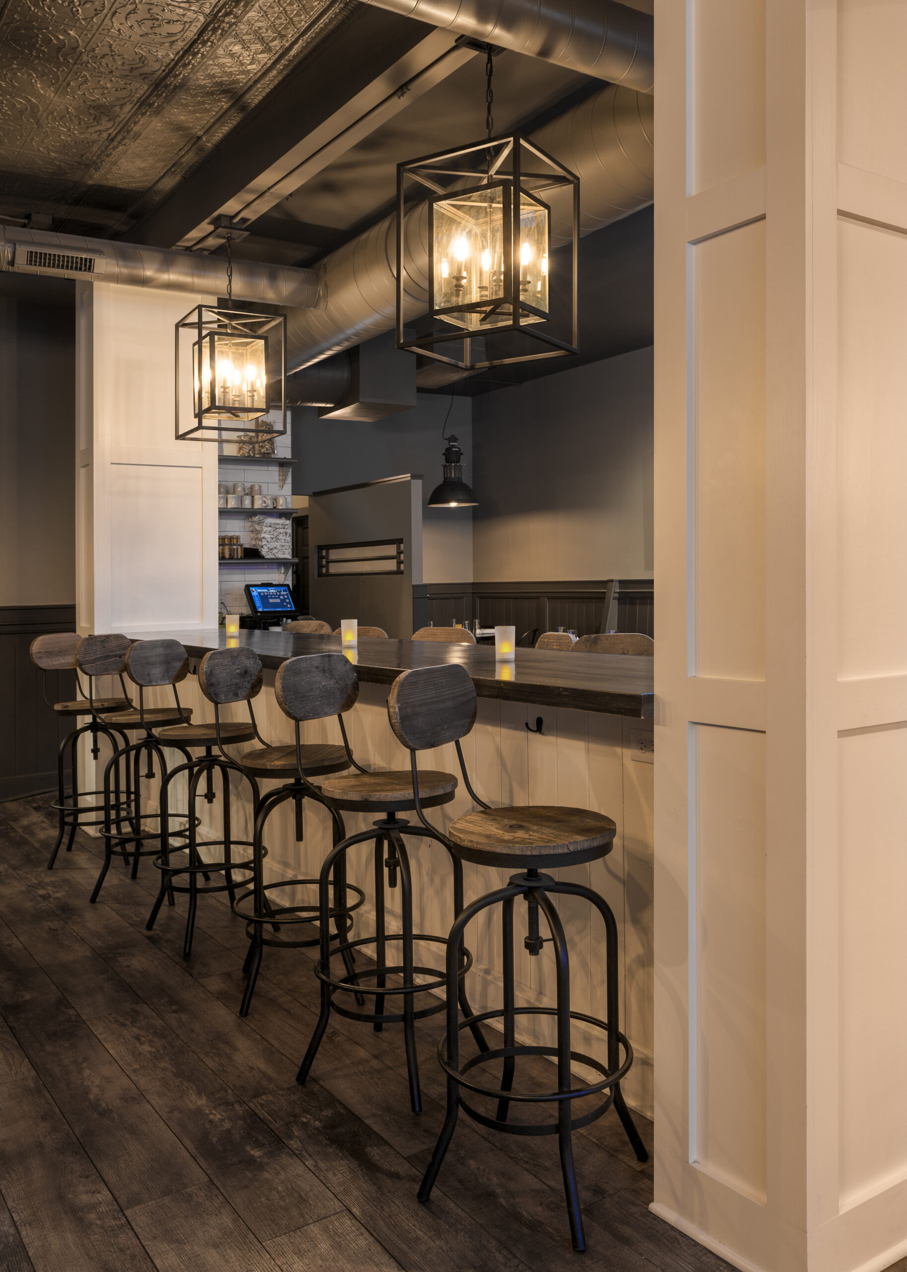Industrial-style bar with metal stools
